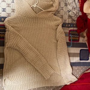 A cream hooded sweater, size S